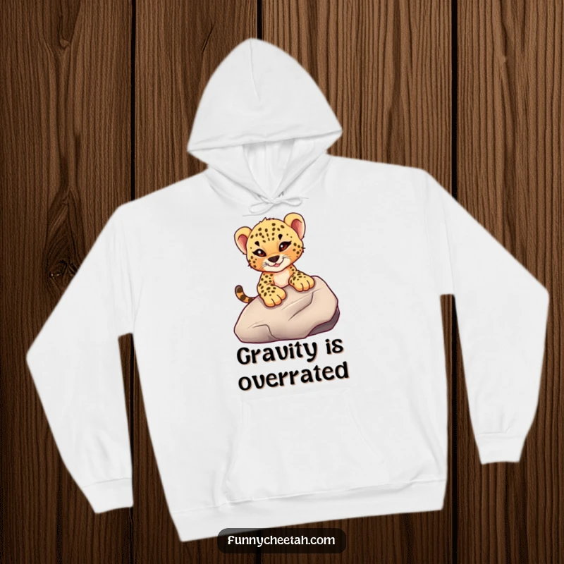 Funny hoodie depicting a cheetah cub with a mischievous wink sliding down a smooth rock, combining comfort with a spirit of daring adventure.