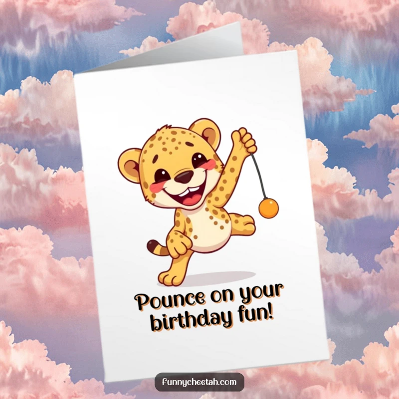 Free Printable Birthday Card: A cheetah with a huge, excited grin leaps joyfully towards a dangling toy, full of anticipation.