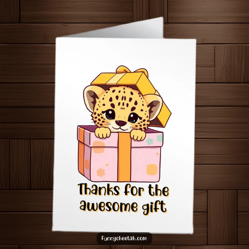 Funny Free Printable Cheetah Cub Thank You Card: Cub peeks playfully from an oversized colorful gift box, expressing thanks.