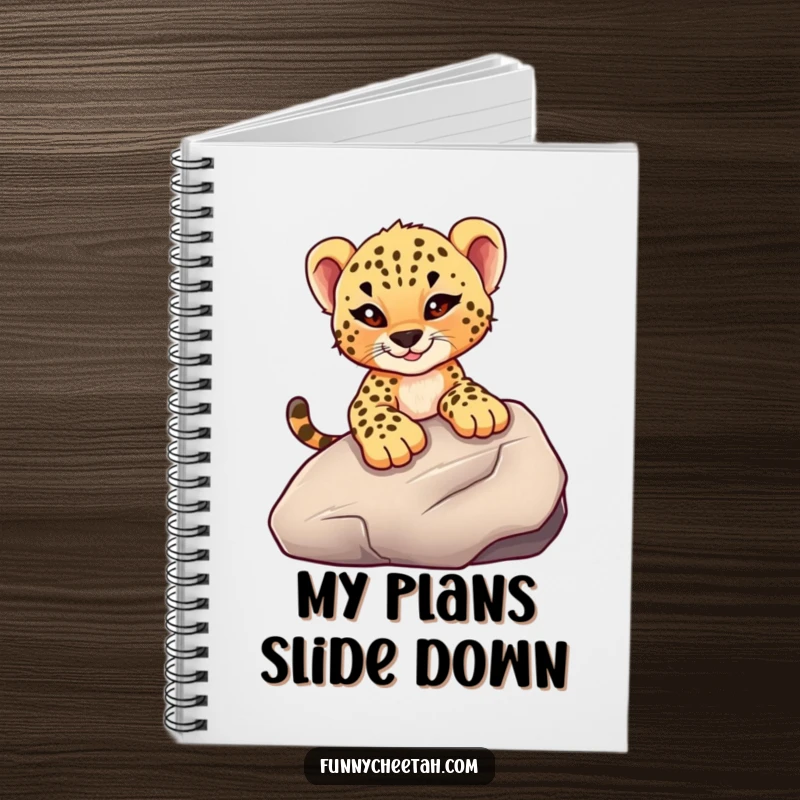 Funny notebook featuring a cheetah cub with a mischievous wink sliding down a smooth rock, perfect for capturing adventurous thoughts and ideas.