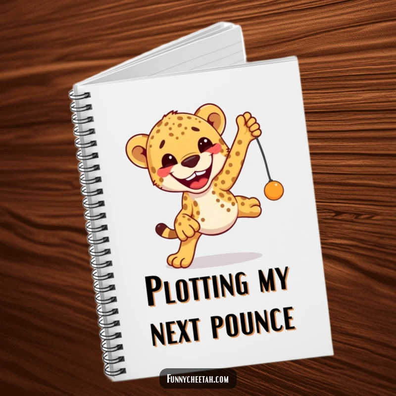 Funny Cheetah Notebook depicting an excited cheetah with a grin leaping towards a toy, perfect for jotting playful ideas.